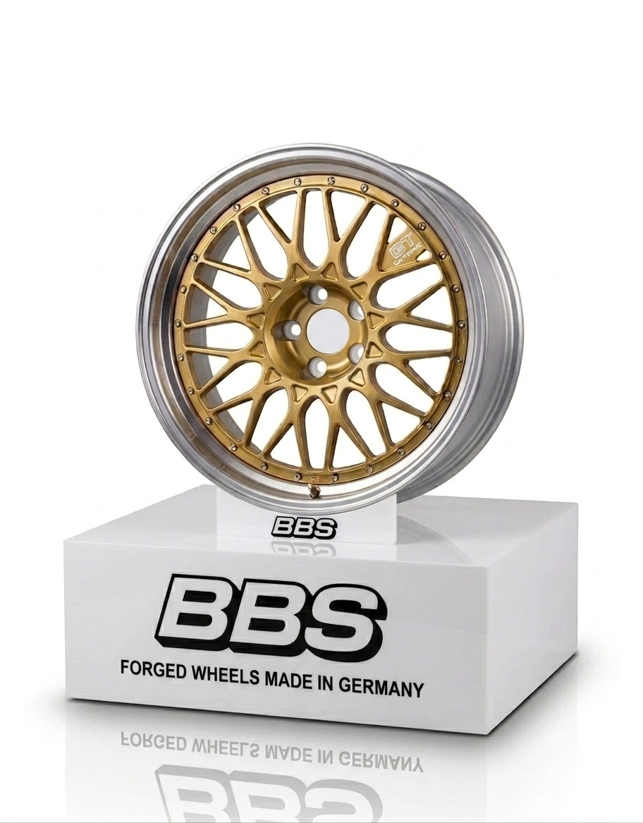 Gold BBS multi-spoke alloy wheel model showcased on a white branded showroom display pedestal base