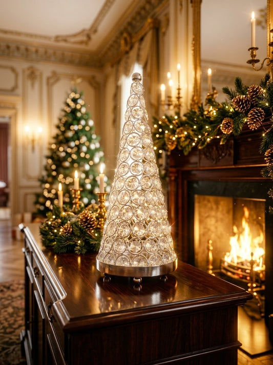 Luxury glowing crystal Christmas tree luminary set on a dark wood console beside a cozy fireplace and lit holiday tree