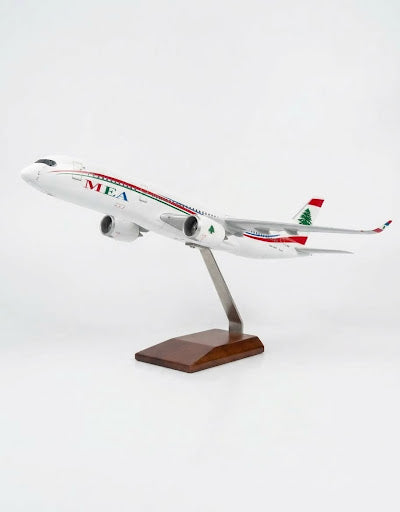 Side profile of Middle East Airlines MEA Airbus A320 resin airplane model on display stand in Lebanon
