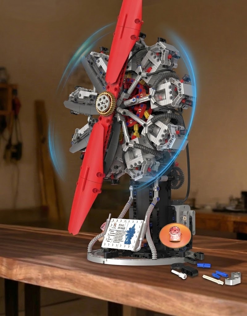"A collection of advanced mechanical building block kits: a working V8 engine, radial motor, F1 steering wheel, and rim wheel hub."