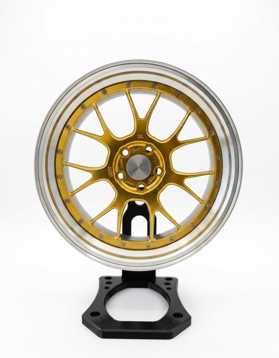 Gold 10cm diecast aluminum mini wheel replica mounted on a black rotating desk display stand