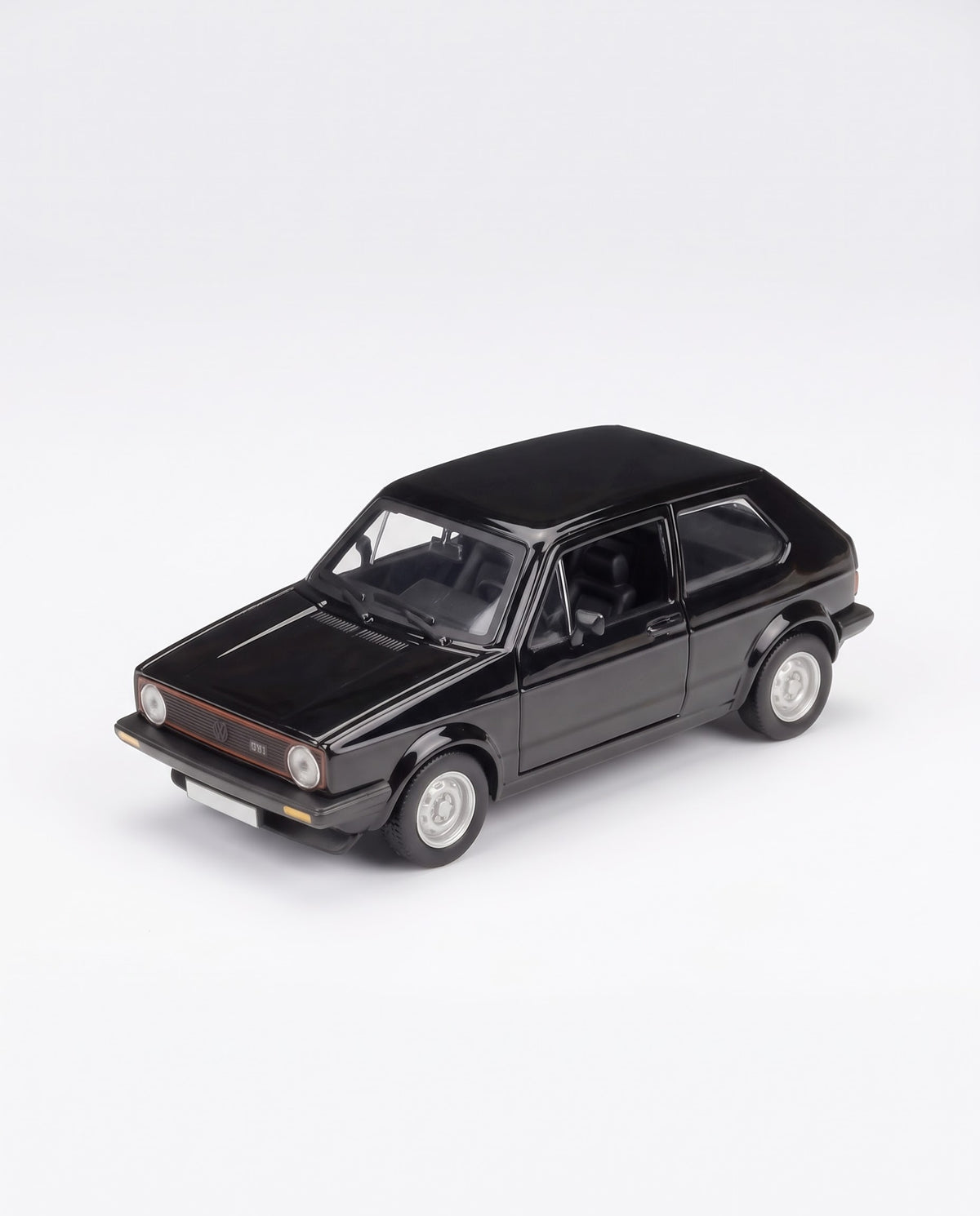 Elevated front three-quarter studio shot of 1979 Volkswagen Golf GTI Mk1 black collectible metal diecast model car.