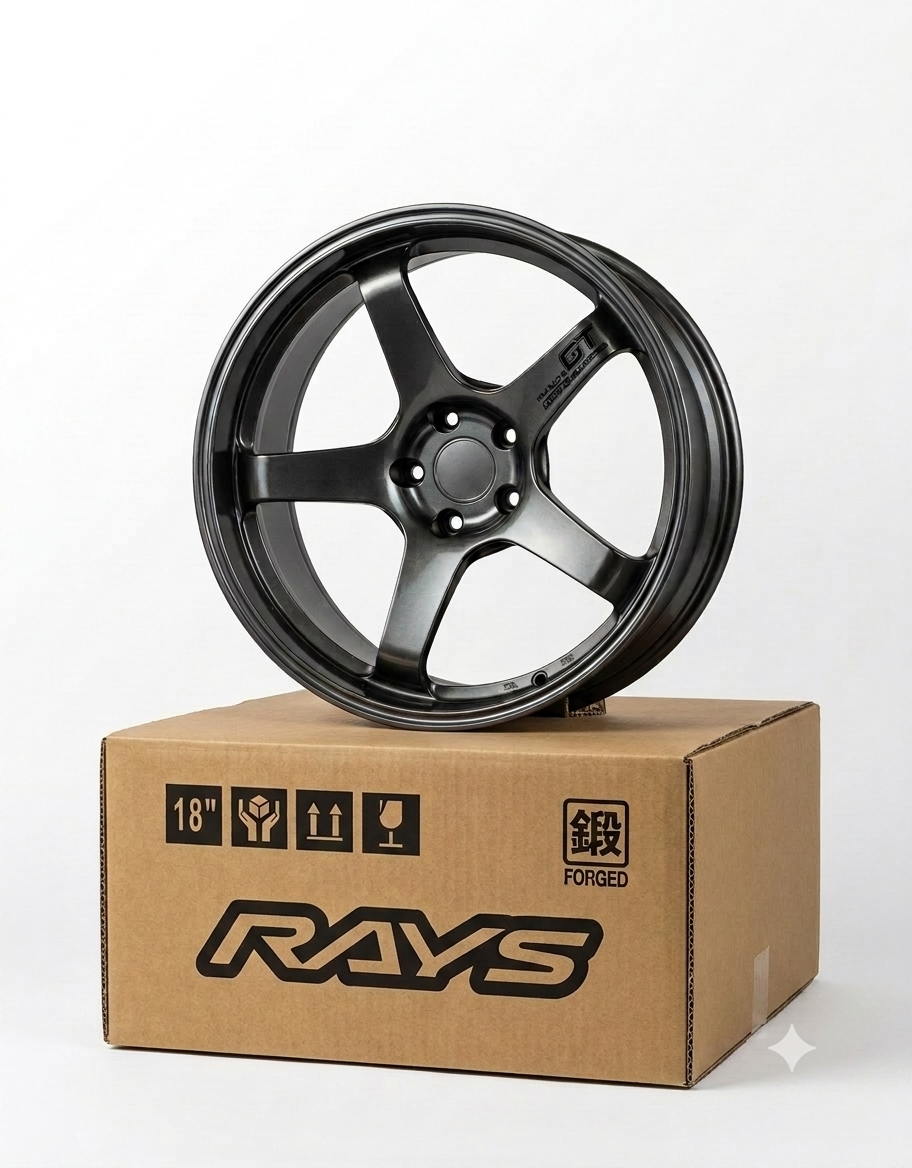 5-spoke gunmetal mini aluminum wheel model sitting on top of miniature 18-inch replica RAYS wheel packaging box.