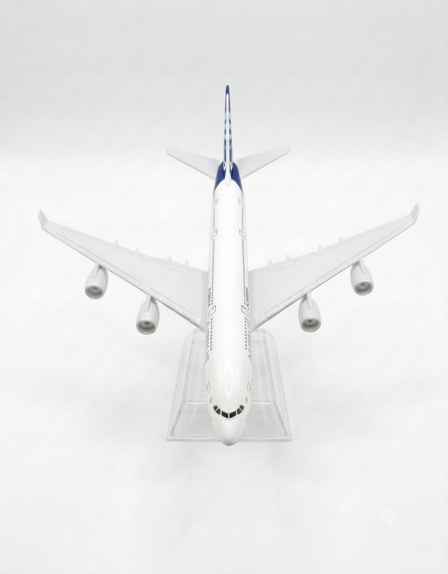 Top-down aerial view of the Airbus A380 metal diecast plane highlighting the wingspan, four jet engines, and sleek finish on a clear stand.