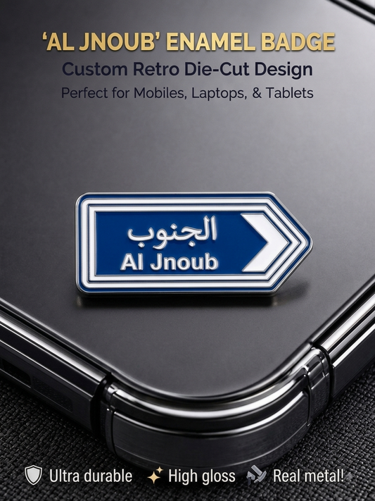 Blue Al Jnoub Arabic and English road sign metal enamel sticker badge with high gloss finish on a mobile phone