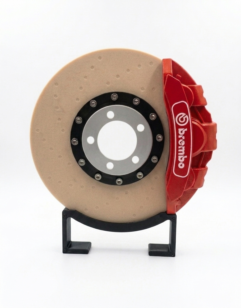 Front view of the automotive brake disc rotor desk lamp in off mode showing realistic rotor and red caliper details.
