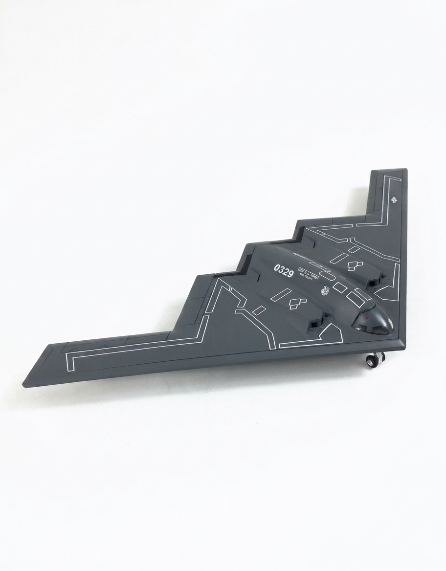 Side profile view of 1:200 scale B-2 Spirit stealth bomber diecast military airplane model resting on landing gear