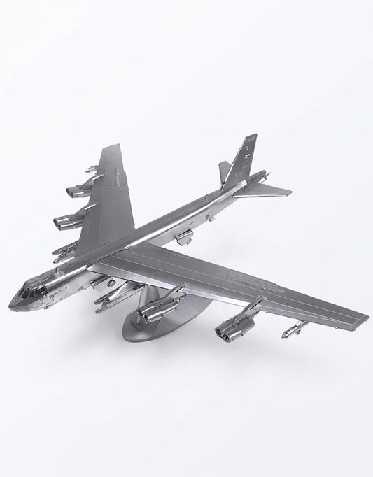 Fully assembled B-52 Stratofortress 3D metal puzzle model airplane mounted on a silver display stand.
