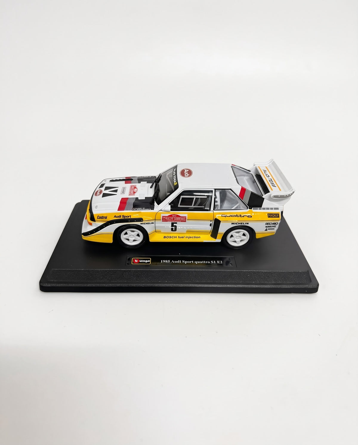 Bburago 1:24 scale 1985 Audi Sport quattro S1 E2 rally diecast model car on black display base with white background, available in Lebanon at Gadgets Lebanon.
