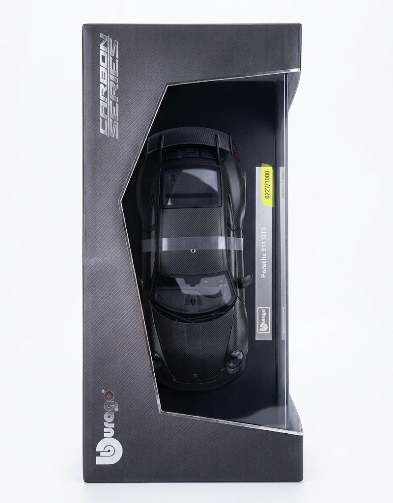 Top-down view of Bburago 50th Anniversary Carbon Series Porsche 911 GT3 inside original packaging with serial tag.