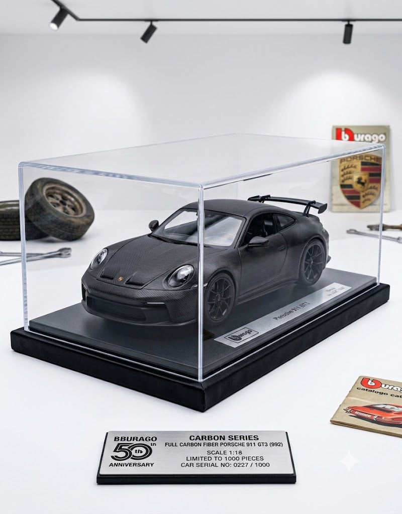Bburago 50th Anniversary 1:18 full carbon fiber Porsche 911 GT3 992 diecast model in acrylic showcase with numbered plaque.