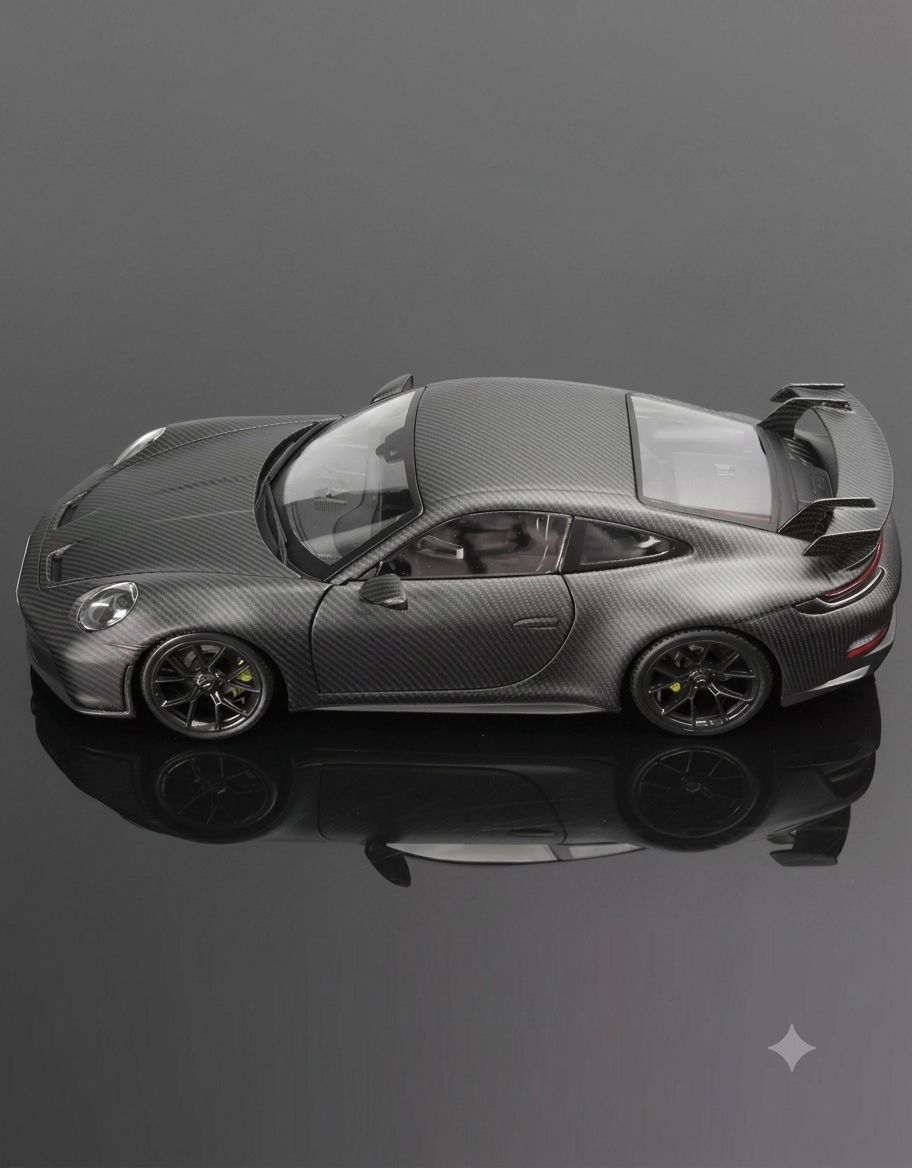 Side profile view of Bburago 1:18 Porsche 911 GT3 992 showcasing full-body textured carbon fiber weave finish.