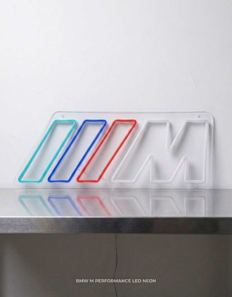 BMW M Power logo LED neon sign with tricolor stripes and white letter M unlit on a clear acrylic backing.