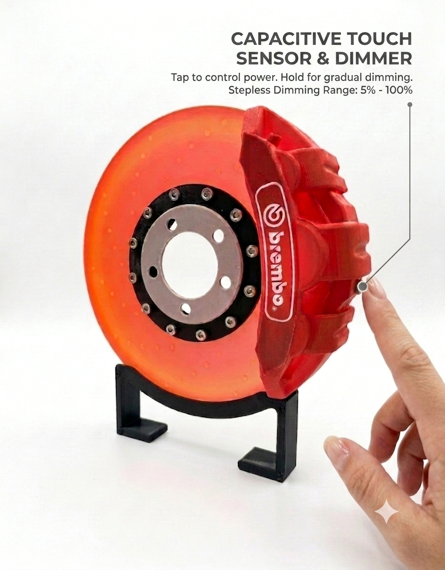 Close-up of the capacitive touch sensor and stepless dimmer control on the automotive brake disc rotor desk lamp.