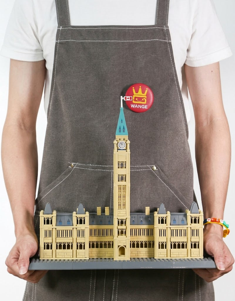 In hand scale comparison showing the completed Wange Canadian Parliament Hill 608-piece brick architecture model