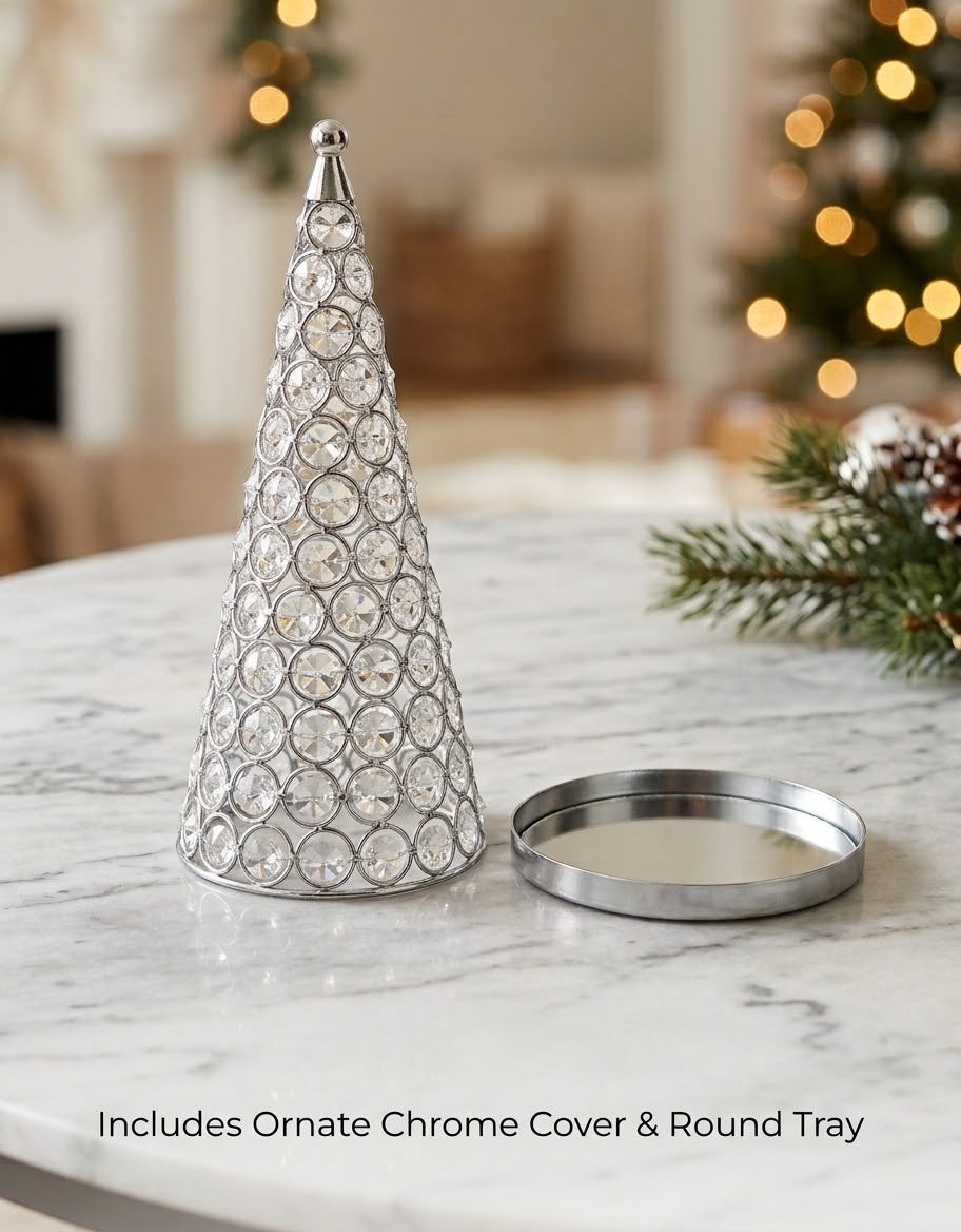 Silver faceted crystal cone Christmas tree cover shown beside its matching round chrome base tray on a marble table.