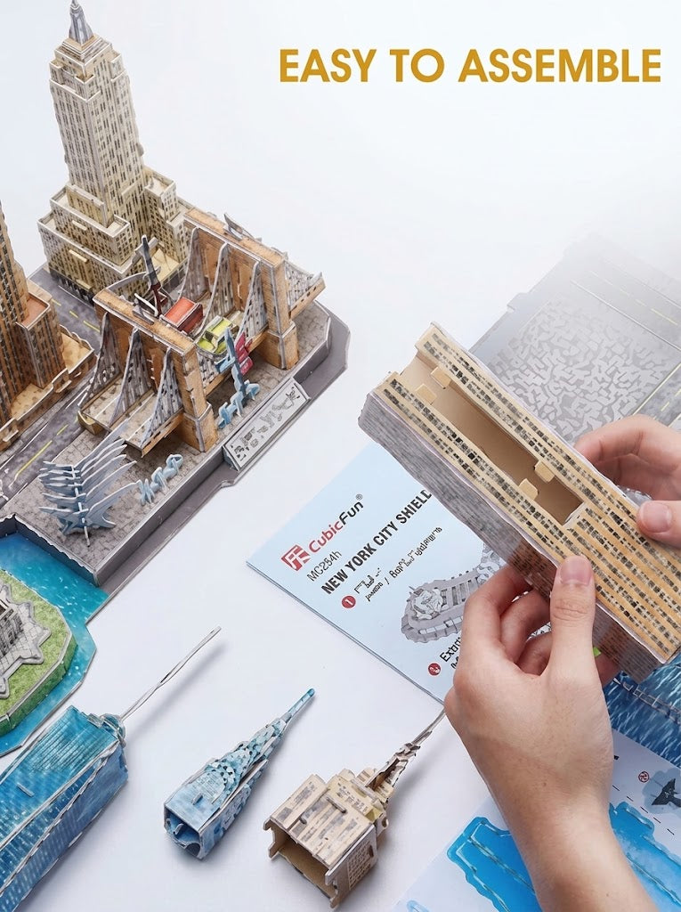 Hands assembling a CubicFun 3D architectural cityline puzzle without tools or glue, available with delivery across Lebanon.