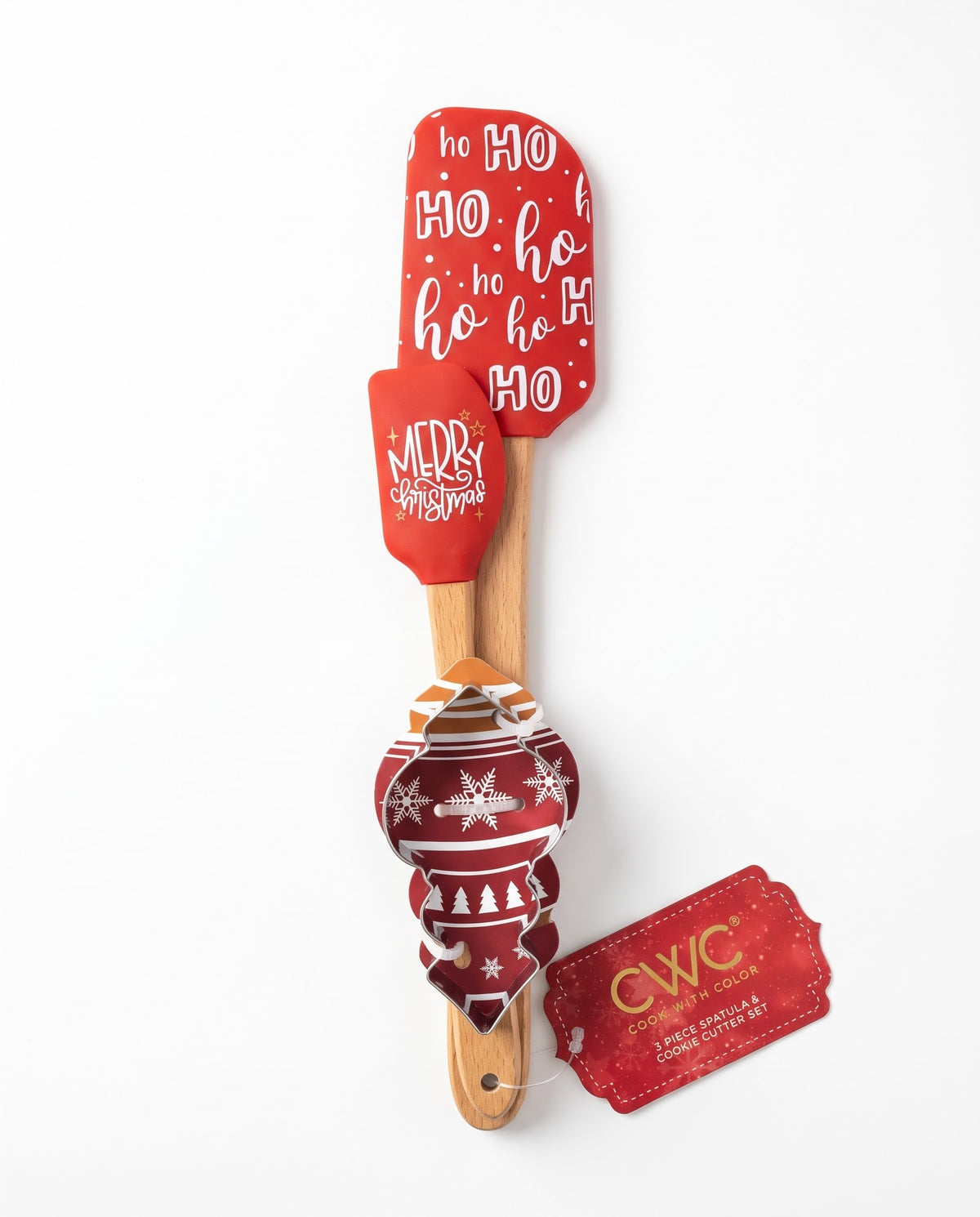 Cook With Color 3-piece Christmas baking set featuring a red Ho Ho Ho silicone spatula, mini Merry Christmas spatula, and holiday ornament cookie cutter with wooden handles, available at Gadgets Lebanon.