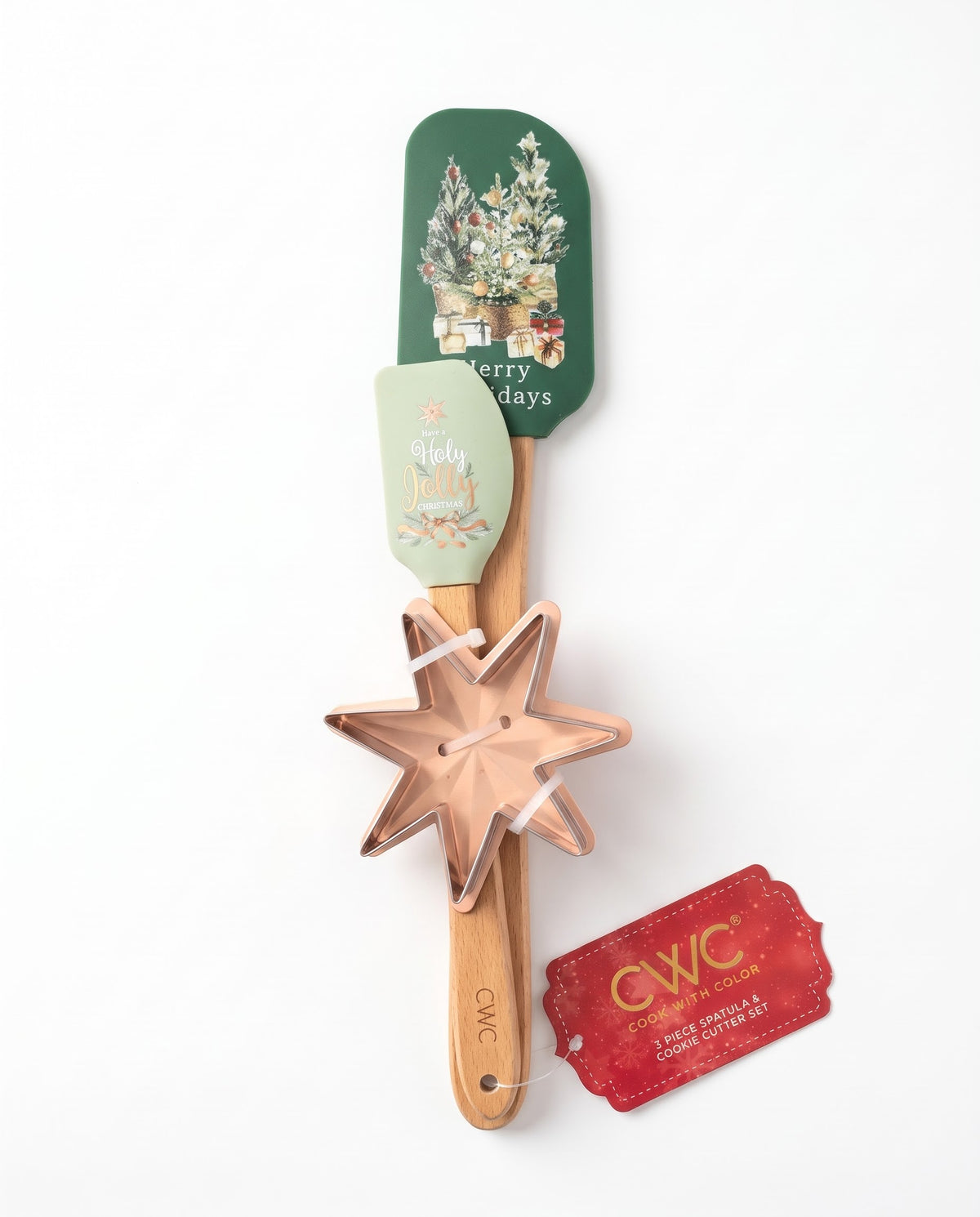 Cook With Color 3-piece festive kitchen set with a green Christmas tree spatula, mini Holy Jolly spatula, and rose gold star cookie cutter with natural beechwood handles, available in Lebanon.