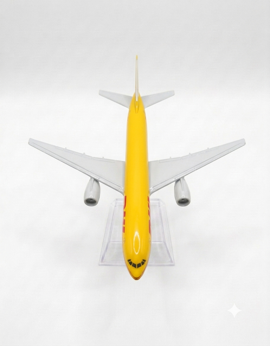 Top-down overhead view of yellow DHL livery diecast metal plane showing wingspan and fuselage detailing.
