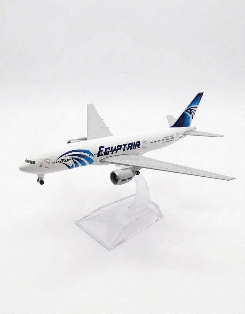 EgyptAir Boeing 777 15cm diecast metal airplane model on clear acrylic stand, authentic Cairo airline souvenir and aviation collectible.