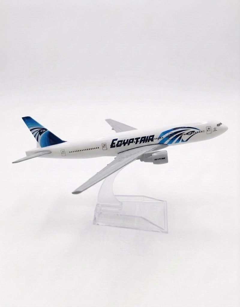 Side view of EgyptAir Boeing 777 diecast aircraft featuring iconic blue Horus tail livery, twin engines, and desktop display mount.
