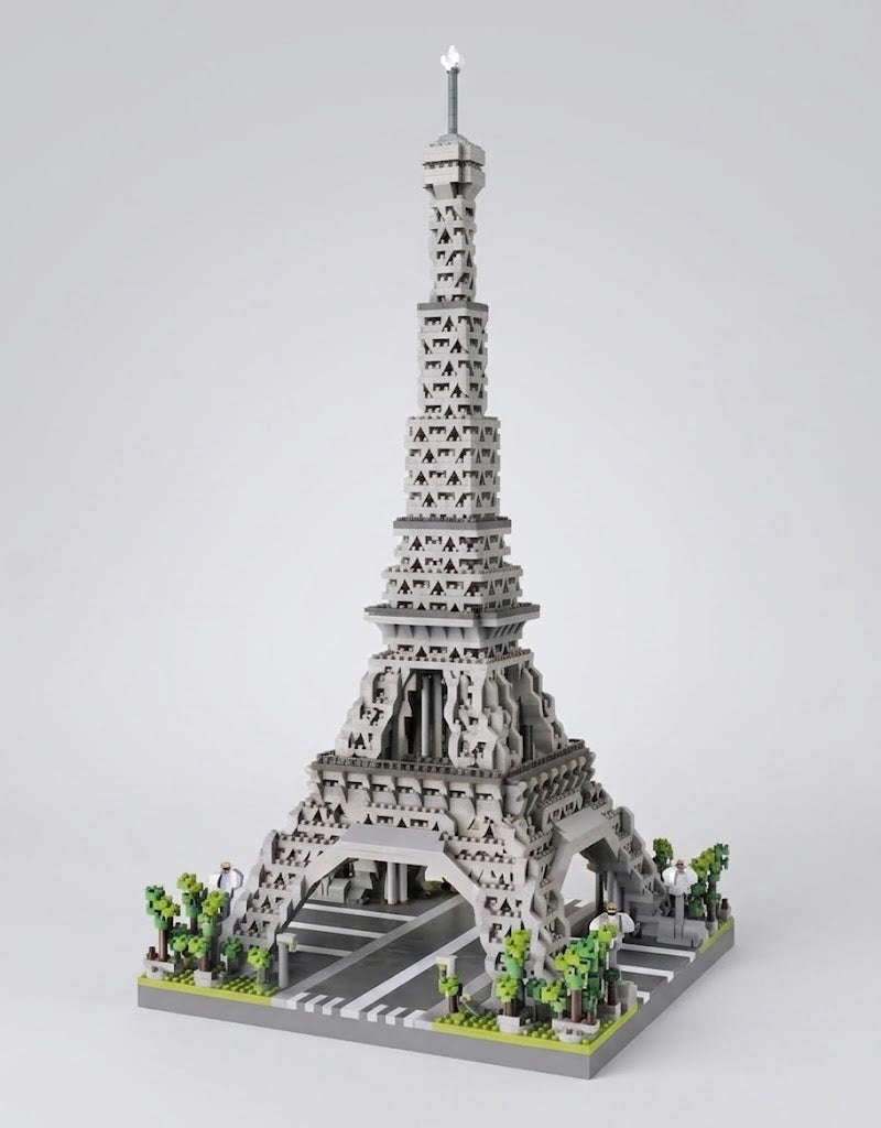 Assembled 3D Eiffel Tower architecture building blocks model set with detailed base and trees, available for delivery in Lebanon.