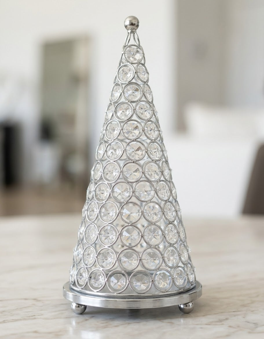 Faceted crystal bead cone Christmas tree candle cloche fitted on a round polished silver tray with ball feet.