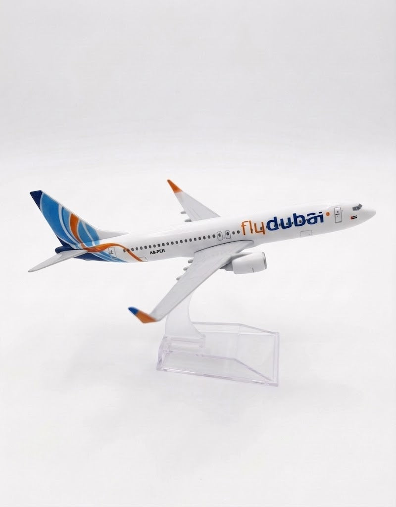 Side perspective view of Flydubai 15cm metal model airplane with detailed tailfin livery and transparent desktop display stand