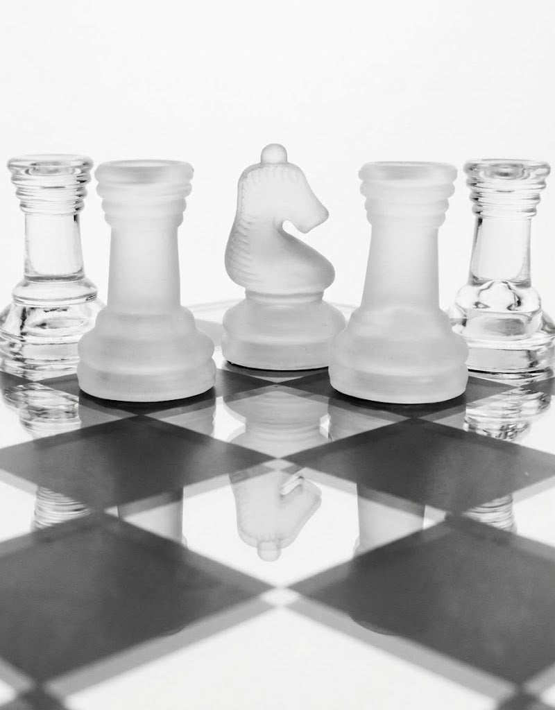 Frosted glass knight chess piece showcasing the protective black velvet inlay base