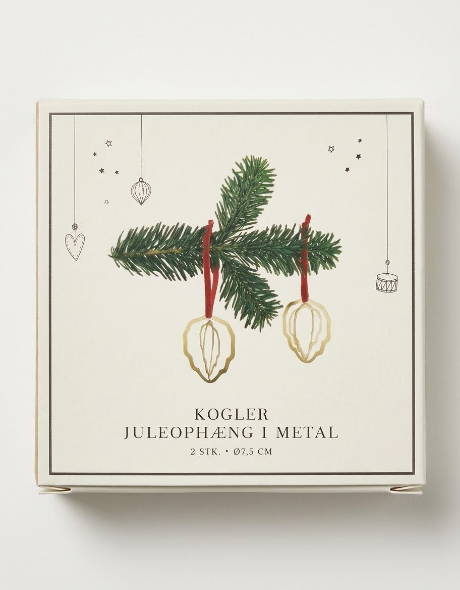 Two gold metal pinecone shape Christmas hanging ornaments with red ribbon ties packaged in illustrated gift box.