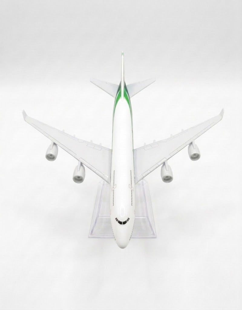 Top view of Iraqi Airways four-engine diecast aircraft model with wings and clear acrylic base.