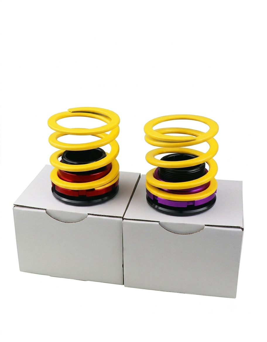 Two height-adjustable JDM car coilover shock absorber pen stands displayed with their white retail packaging boxes.