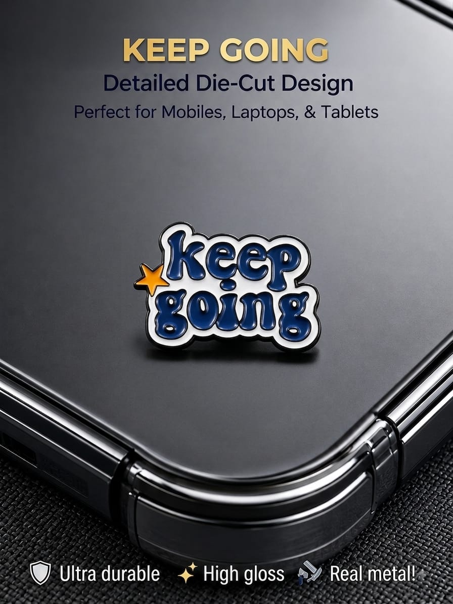 Keep Going high-gloss metal enamel sticker with die-cut lettering on the back of a smartphone.