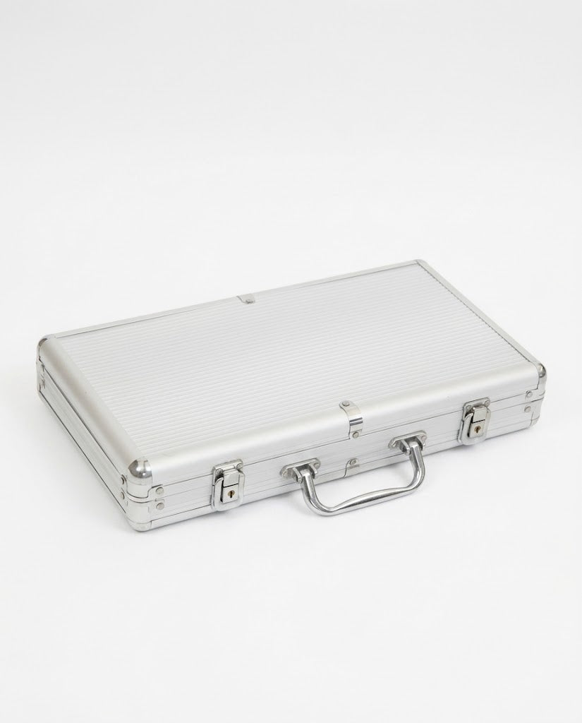 Heavy-duty lockable silver aluminum carrying case with handle and dual latches for casino poker chip set.