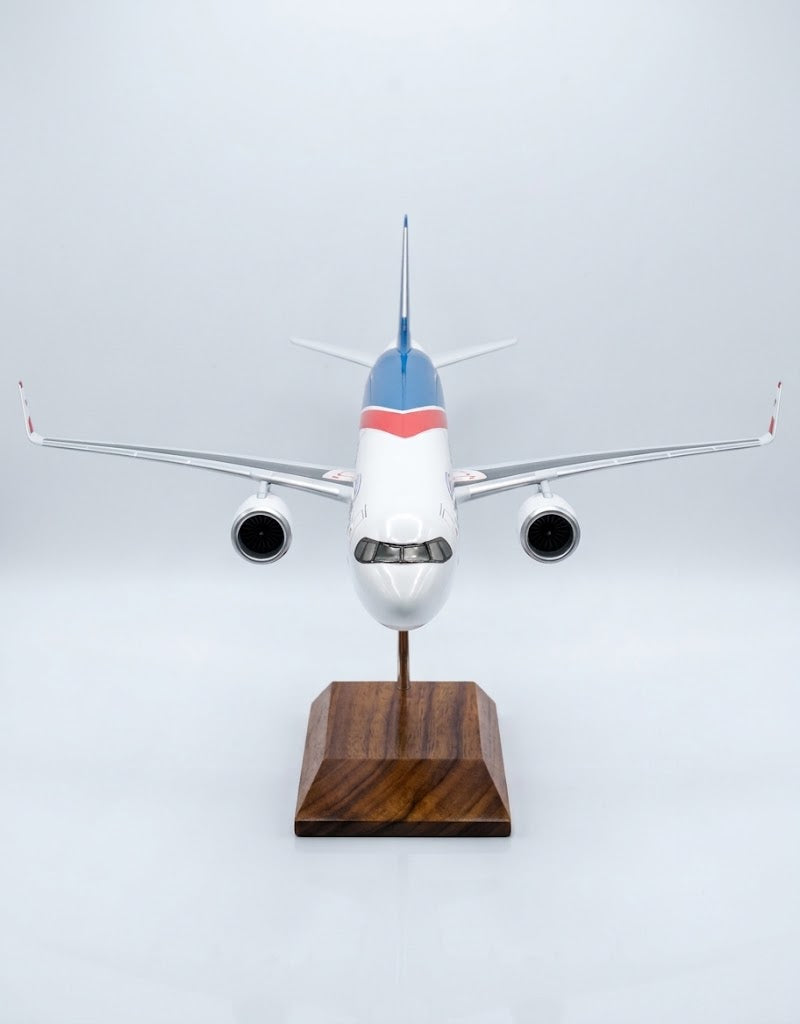 Front head-on view of MEA Airbus A321neo scale collectible airplane showing cockpit, engine cowlings, and symmetrical wingspan.