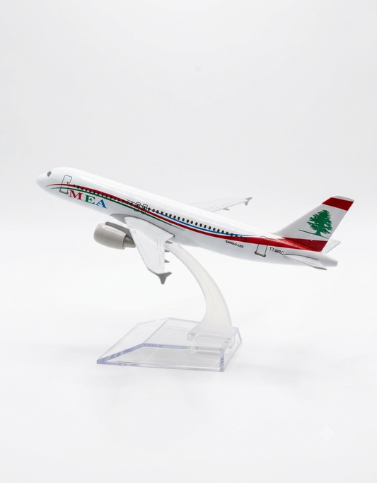 Side profile of the MEA Middle East Airlines collectible scale airplane showing the fuselage markings, T7-MRC registration, and green cedar tail fin.