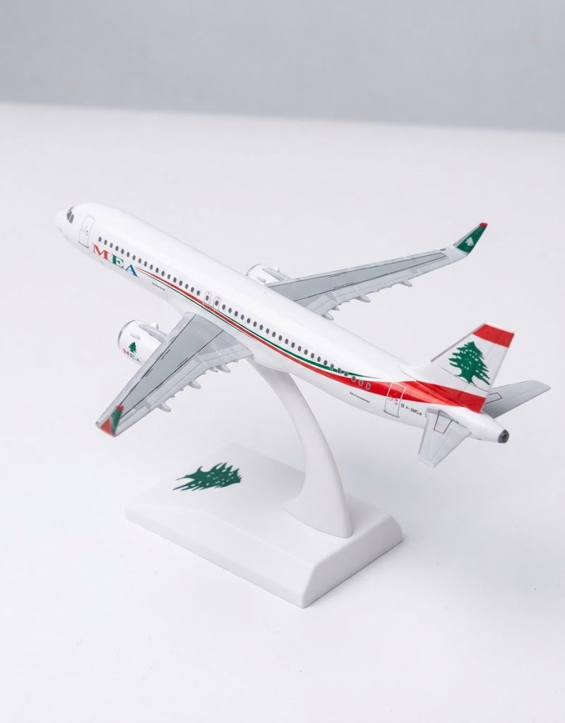 Elevated top-rear angle of MEA Airbus A320 model highlighting the Lebanese cedar tree tail fin livery and wings.