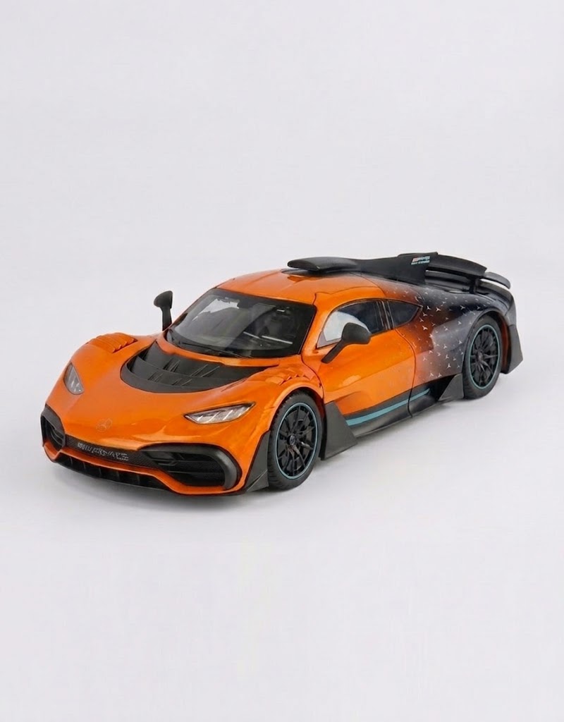 Front three-quarter studio view of orange 1:24 Mercedes-AMG One alloy diecast collectible supercar
