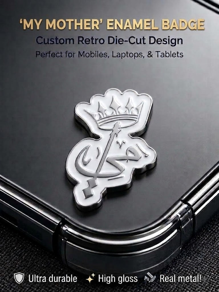 White and silver die-cut enamel metal badge sticker featuring crowned Arabic calligraphy for My Mother applied to a black smartphone case