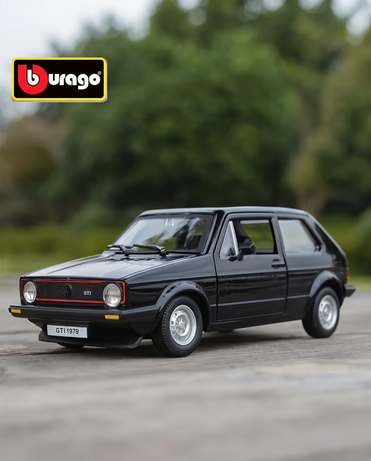 Official Bburago 1979 Volkswagen Golf Mk1 GTI black diecast collector model displayed outdoors on wooden surface.