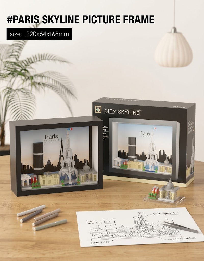 220x64x168mm Paris city skyline 3D micro block picture frame displayed on a wooden desk with architectural blueprint and assembly tools.