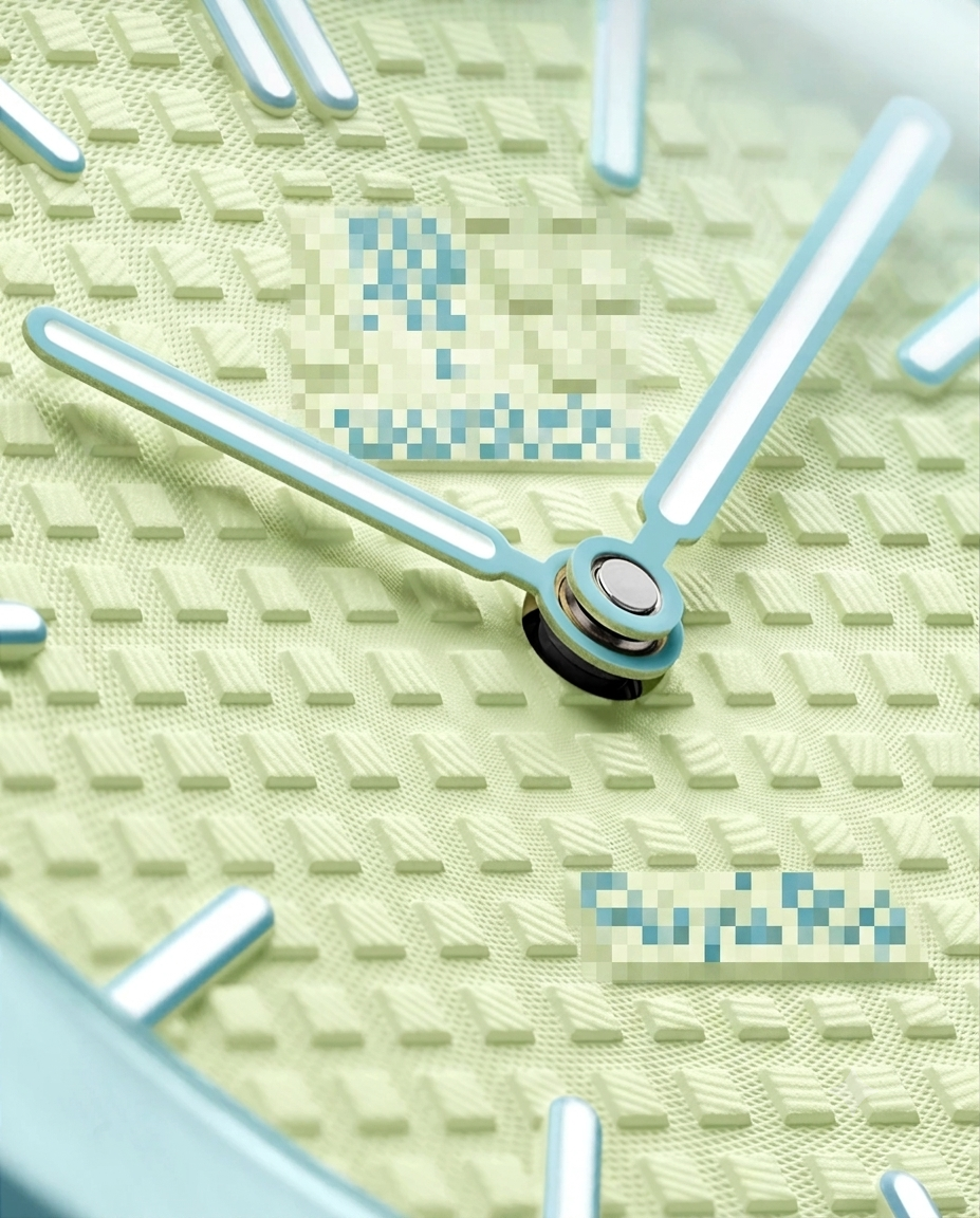 Close-up of the pastel yellow waffle-pattern dial with light blue hands and indices on an octagonal pendant watch.