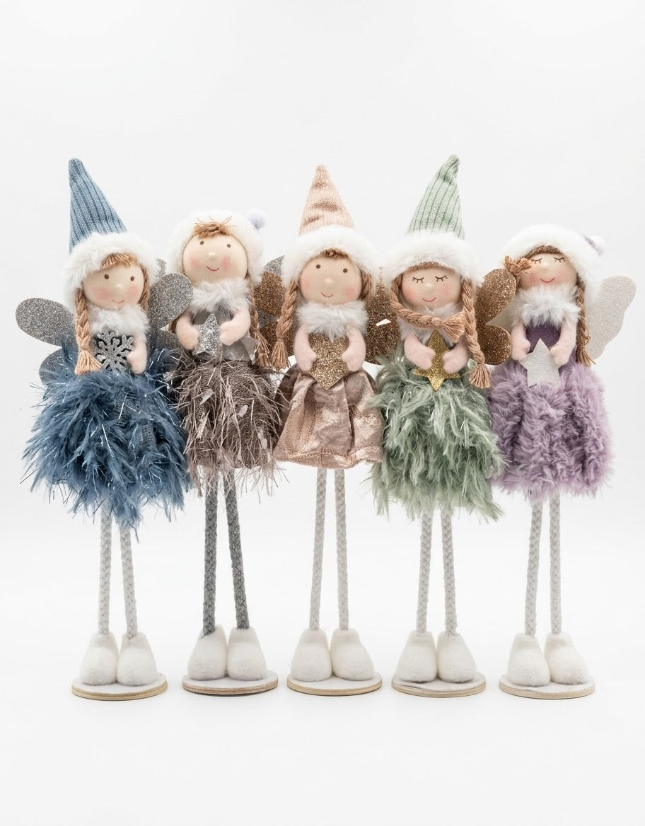 Set of five standing plush Christmas fairy figurines in pastel winter outfits with glitter wings and knit hats on white background.