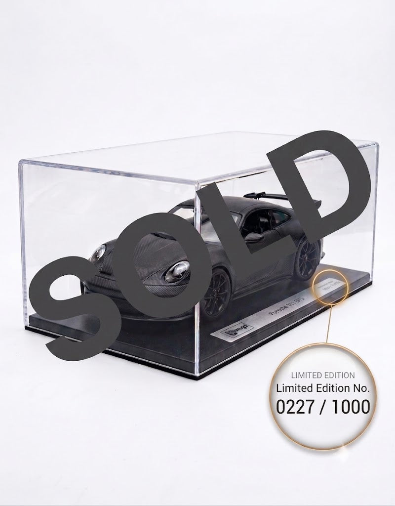 VIP Models Porsche 911 GT3 in full carbon fiber finish inside clear acrylic display case, limited edition collectible scale model car.