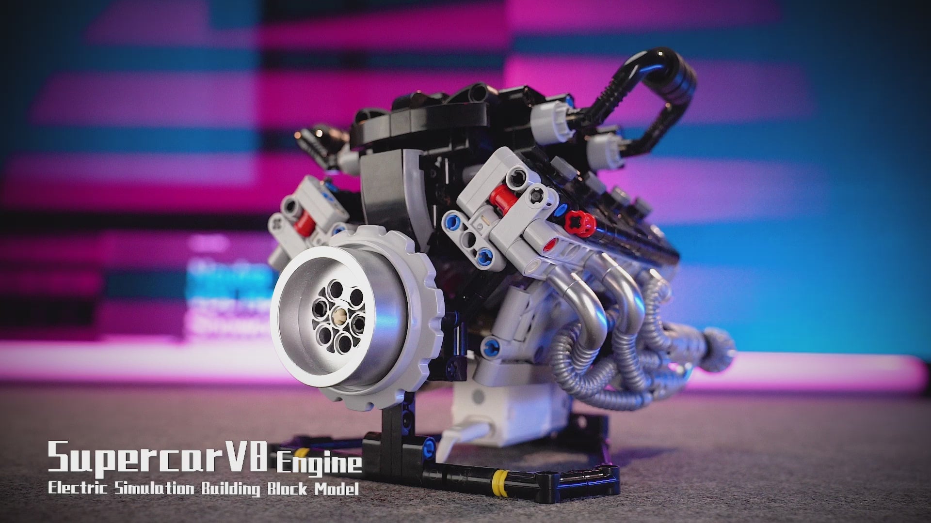 Motorized V8 supercar engine model building block kit with electric motor, moving gears, and display stand