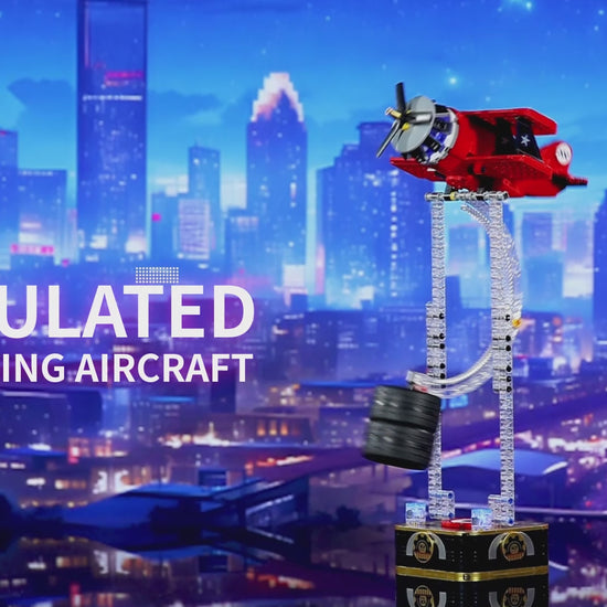 Red gravity swing airplane building block desktop ornament with LED lights swinging on kinetic balance stand.