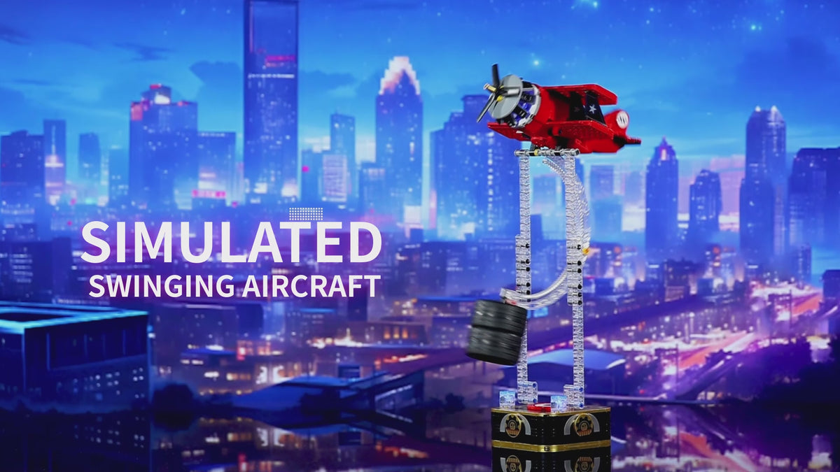 Red gravity swing airplane building block desktop ornament with LED lights swinging on kinetic balance stand.
