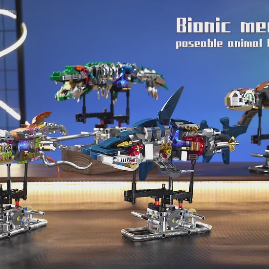 Bionic mech animal building blocks featuring poseable shark, crocodile, and turtle models with LED lights and hand-cranked mechanical motion.