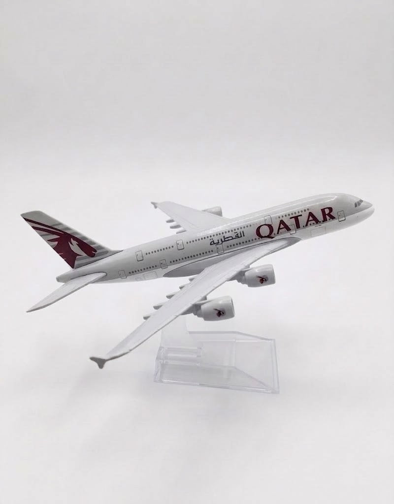 Side profile view of the Qatar Airways Airbus A380 diecast alloy model airplane showing livery details and winglets on display stand.